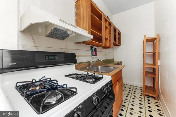 a kitchen with a stove and a microwave