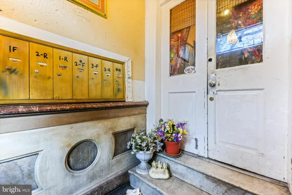 a living room with furniture and flowers