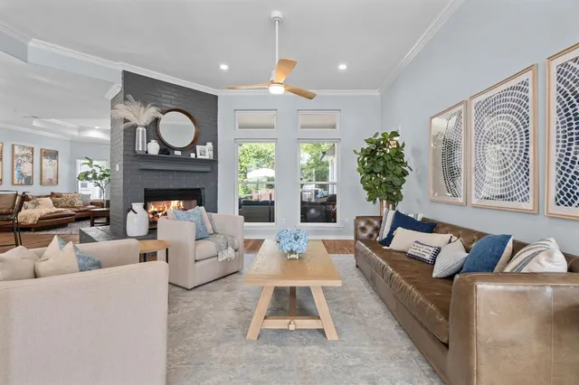 a kitchen with stainless steel appliances granite countertop a sink a stove a kitchen island with chairs and cabinets