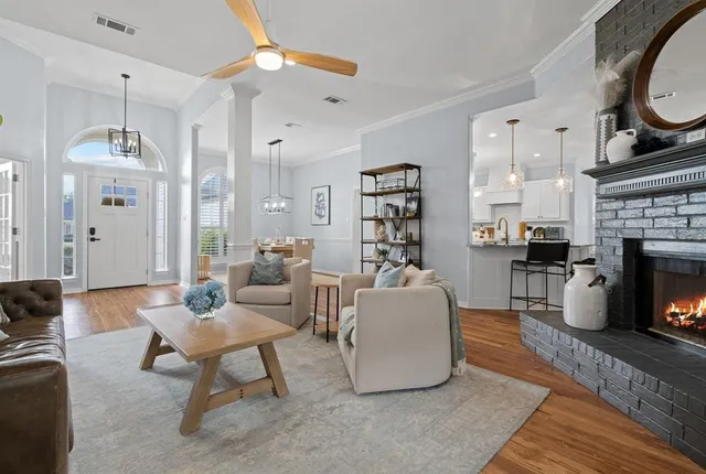 a living room with furniture and a fireplace