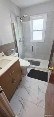 a kitchen with sink refrigerator and cabinets
