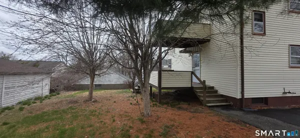 a view of backyard with green space