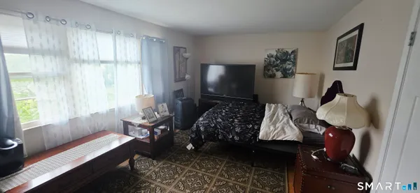 a bed room with a bed and a couch