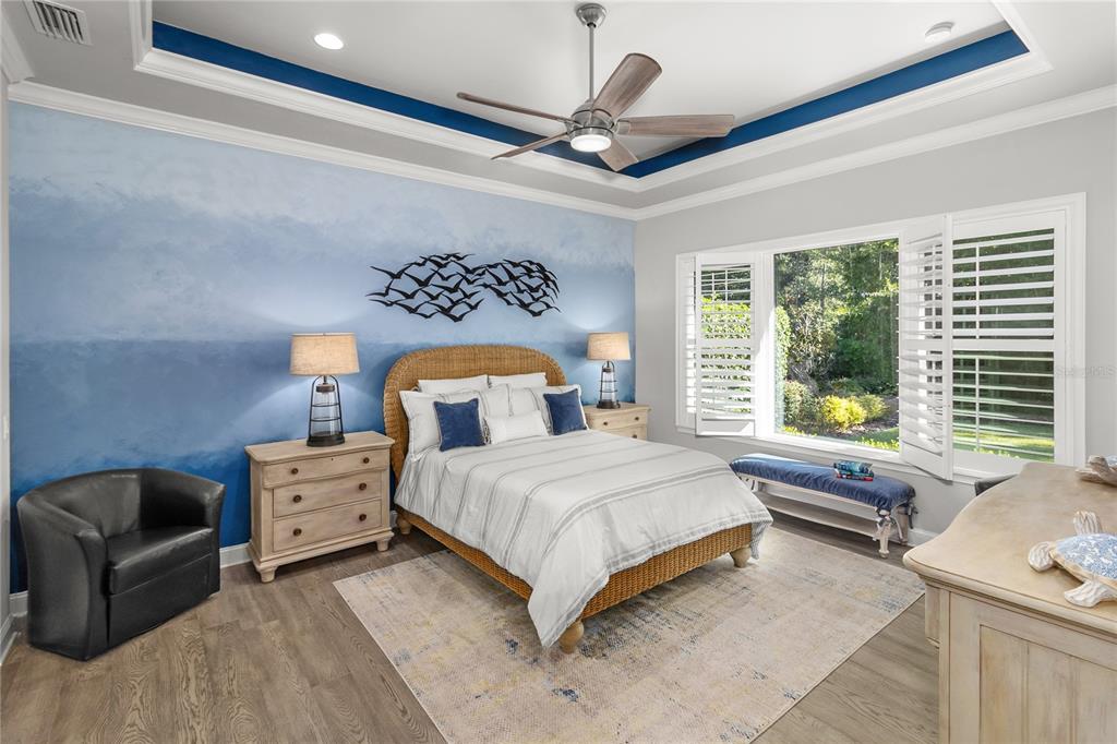 11075 Southwest 38th Boulevard Gainesville, FL 32608 - Photo 11 of 37 a bedroom with a bed couch and window