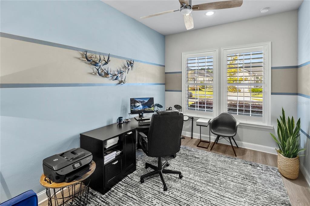 11075 Southwest 38th Boulevard Gainesville, FL 32608 - Photo 17 of 37 a view of a workspace with furniture and a window