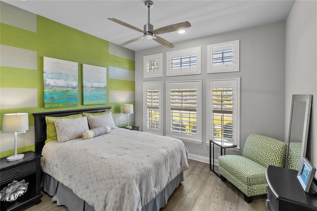 11075 Southwest 38th Boulevard Gainesville, FL 32608 - Photo 18 of 37 a bedroom with a bed window and a couch