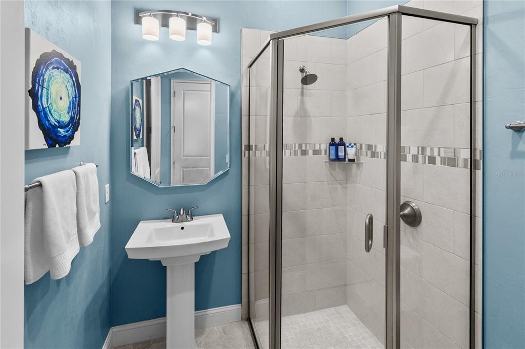 11075 Southwest 38th Boulevard Gainesville, FL 32608 - Photo 21 of 37 a bathroom with a sink and a mirror