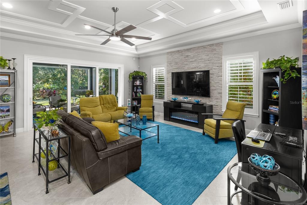 11075 Southwest 38th Boulevard Gainesville, FL 32608 - Photo 3 of 37 a living room with furniture and a flat screen tv