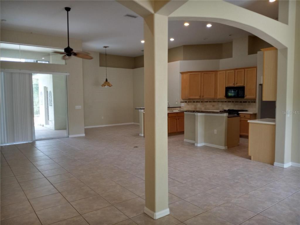 6506 Waters Edge Way Lakewood Ranch, FL 34202 - Photo 7 of 14 a view of a kitchen with a sink and a refrigerator