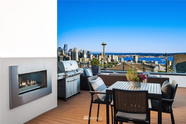 a dining room with furniture and a fireplace