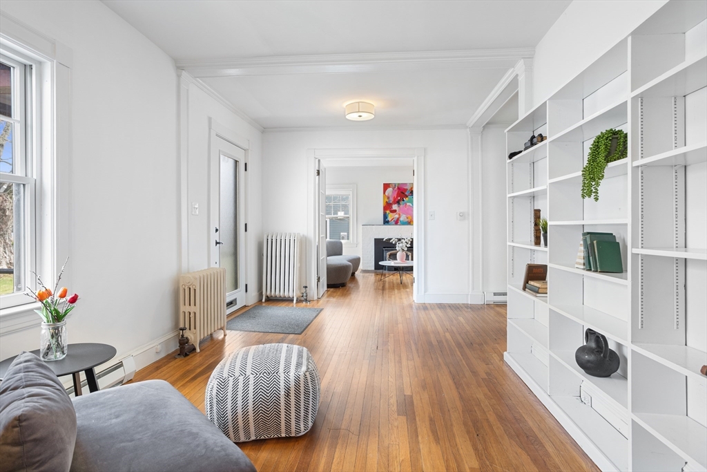 34 Fletcher Road Bedford, MA 01730 - Photo 15 of 42 a living room with furniture and a wooden floor