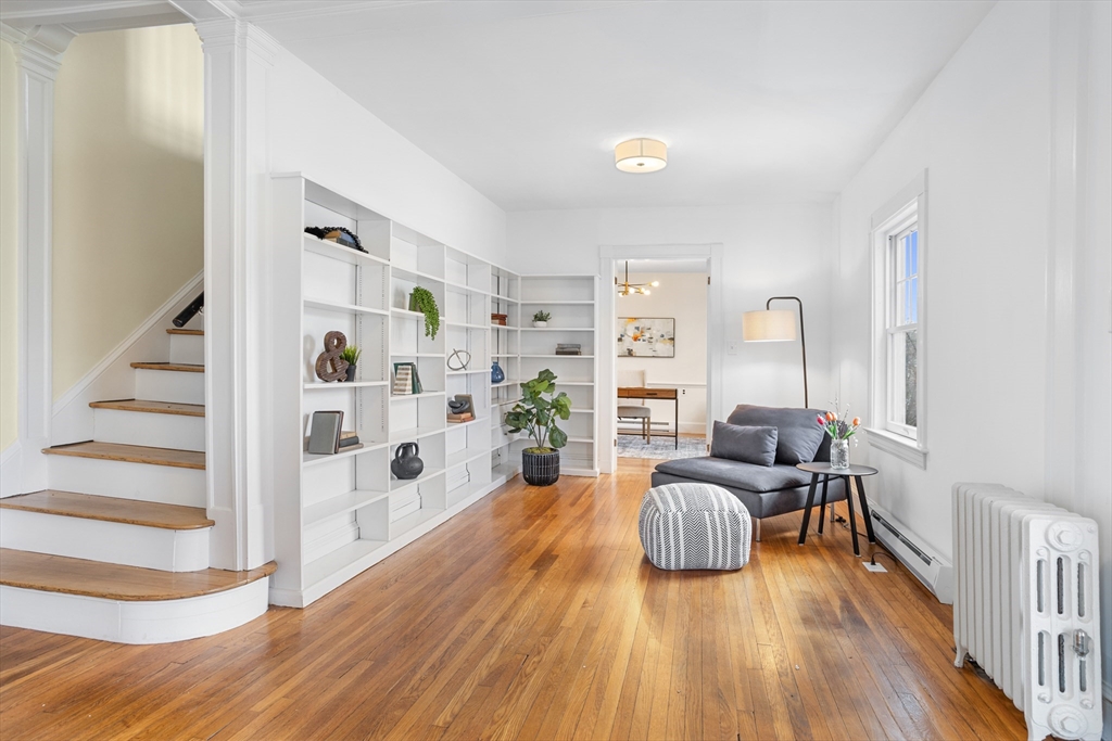 34 Fletcher Road Bedford, MA 01730 - Photo 17 of 42 a living room with furniture and wooden floor