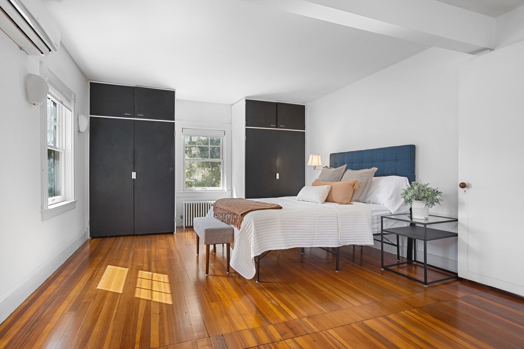 34 Fletcher Road Bedford, MA 01730 - Photo 20 of 42 a bedroom with a bed and wooden floor