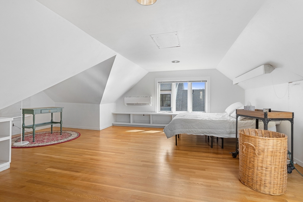 34 Fletcher Road Bedford, MA 01730 - Photo 25 of 42 a living room with furniture and wooden floor