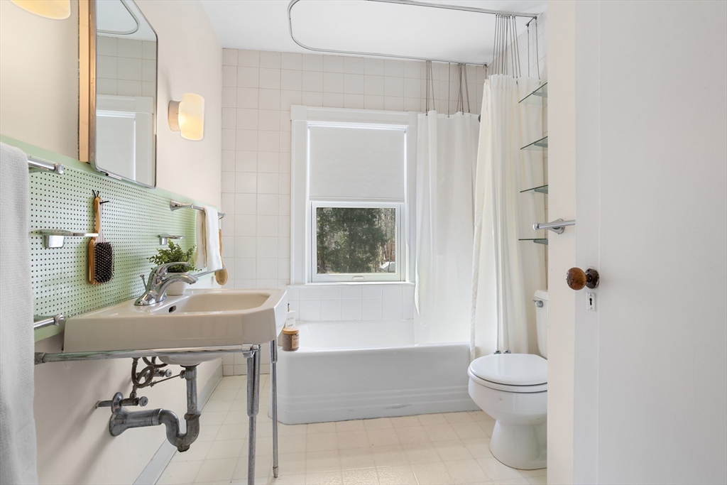 34 Fletcher Road Bedford, MA 01730 - Photo 27 of 42 a bathroom with a sink toilet and shower