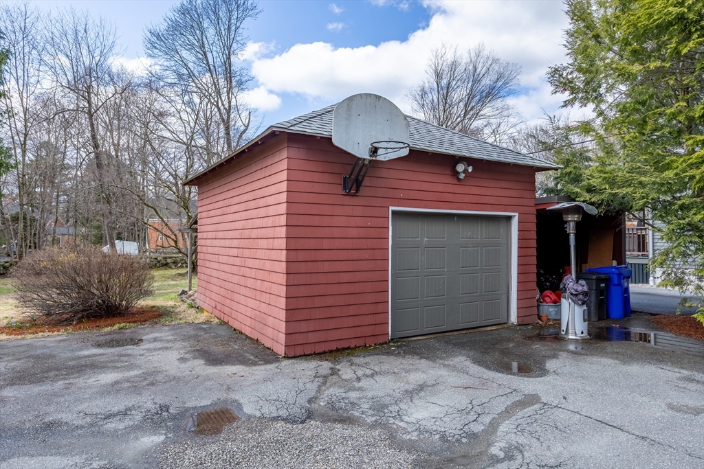 34 Fletcher Road Bedford, MA 01730 - Photo 37 of 42 a view of a house with a small yard and large tree