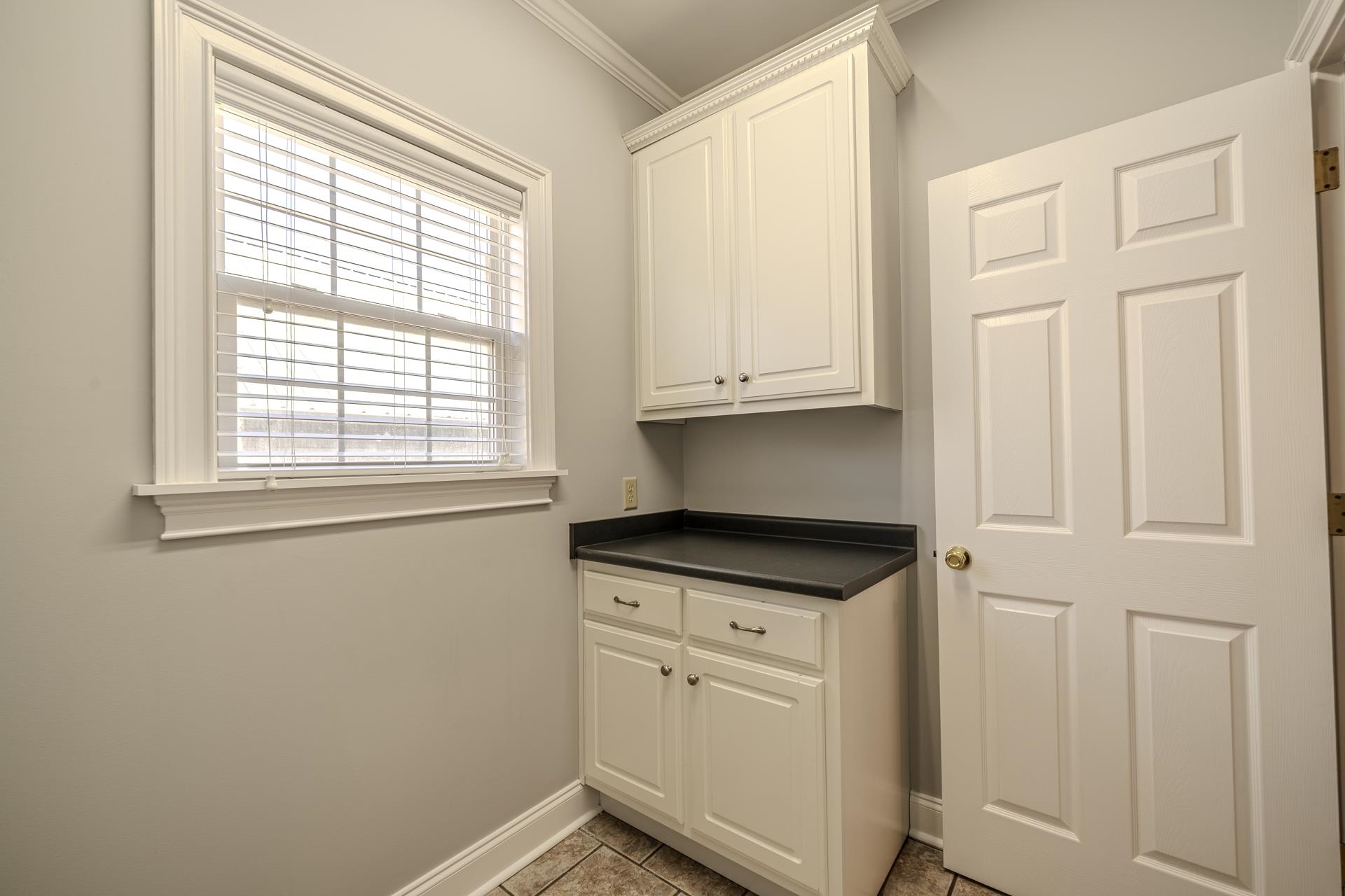 9 Mountain View Iuka, MS 38852 - Photo 11 of 32 Laundry room with crown molding and baseboards