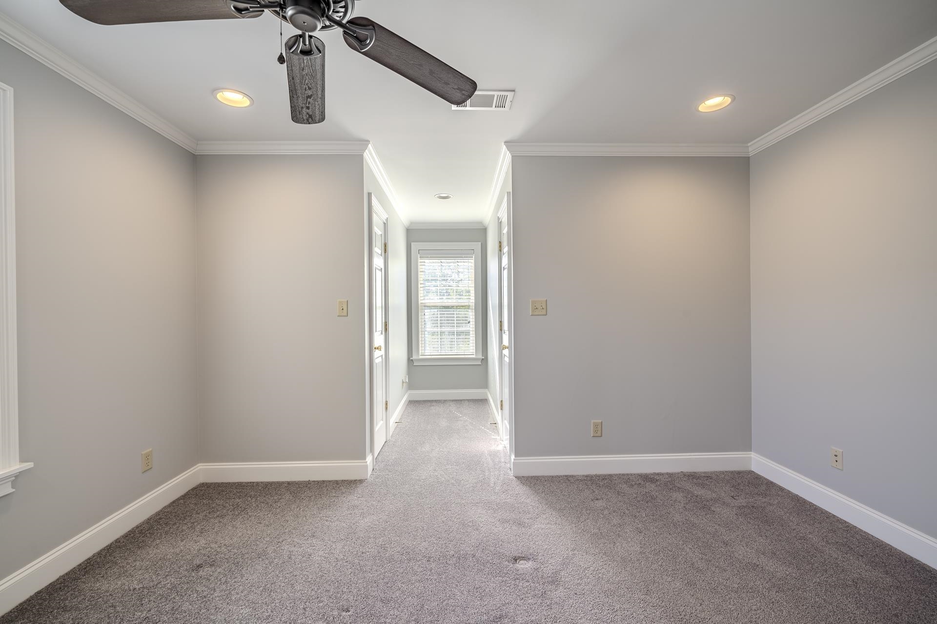 9 Mountain View Iuka, MS 38852 - Photo 20 of 32 Spare room with light carpet, ornamental molding, ceiling fan, and recessed lighting