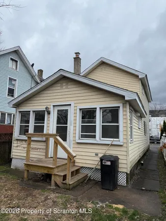 a front view of a house with a porch