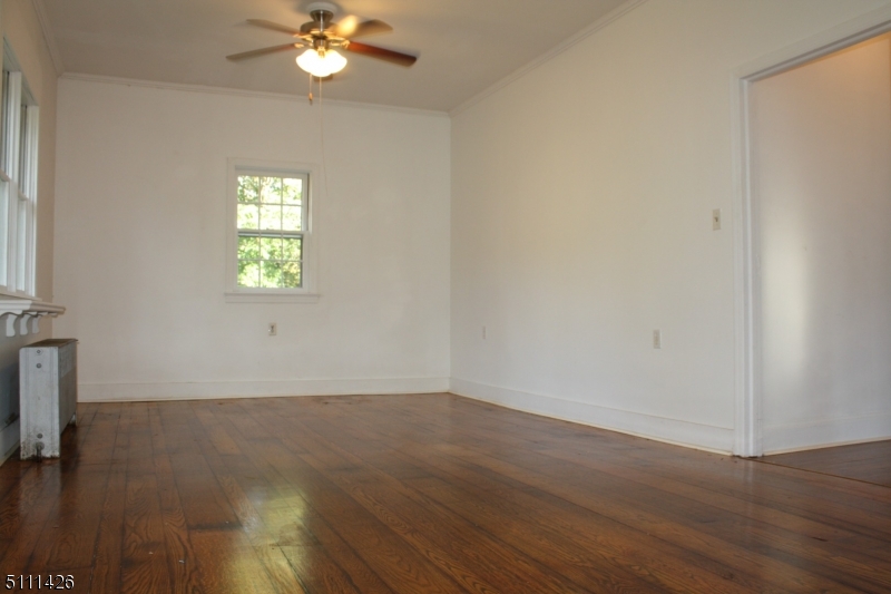 245 Millbrook Road Washington, NJ 07882 - Photo 13 of 34 wooden floor in an empty room with a window