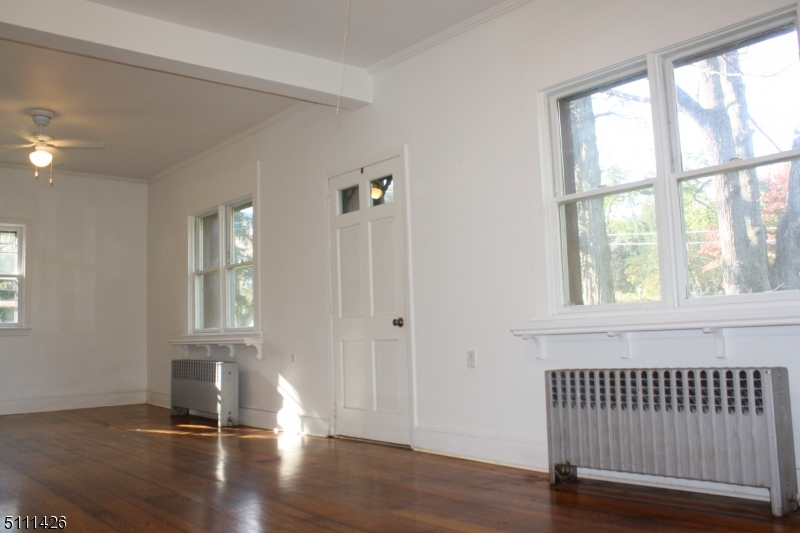 245 Millbrook Road Washington, NJ 07882 - Photo 17 of 34 wooden floor in an empty room with a window