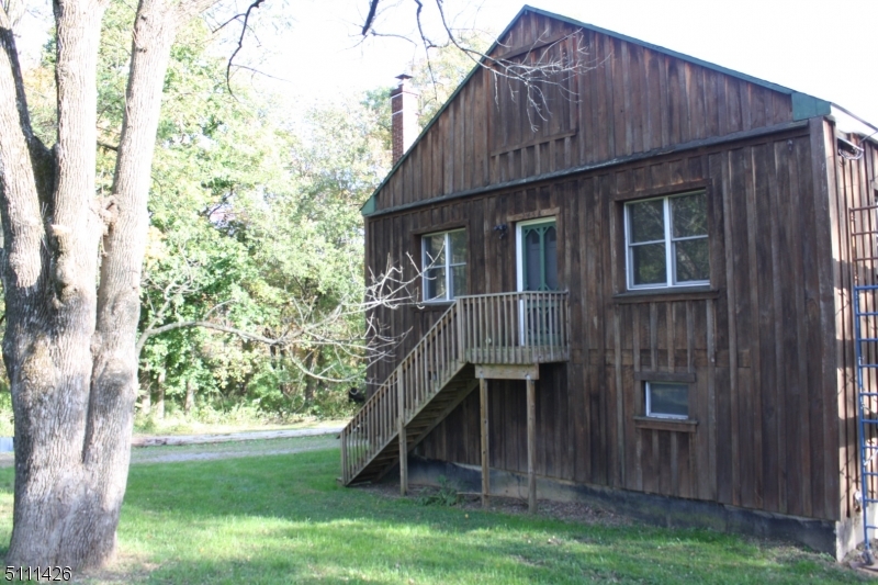 245 Millbrook Road Washington, NJ 07882 - Photo 2 of 34 a house with a tree in front of it