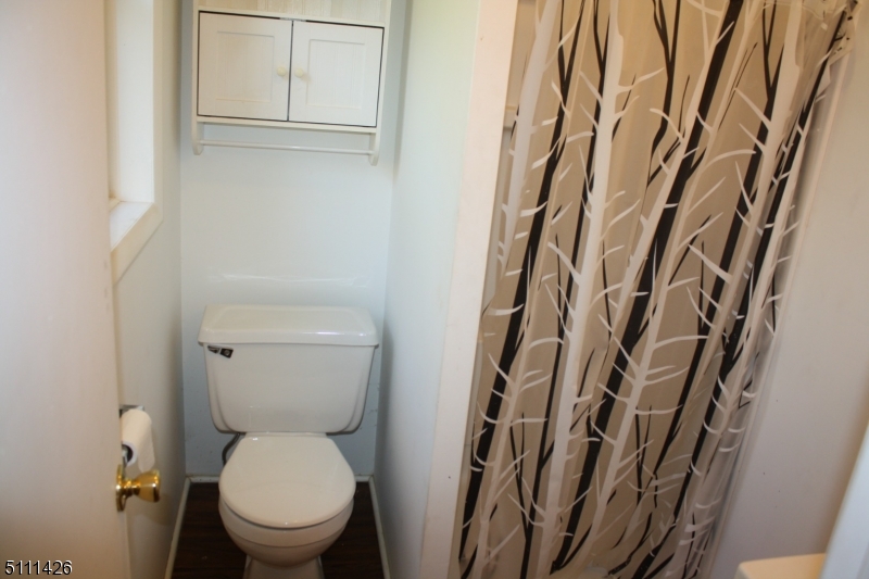 245 Millbrook Road Washington, NJ 07882 - Photo 24 of 34 a white toilet sitting next to a shower