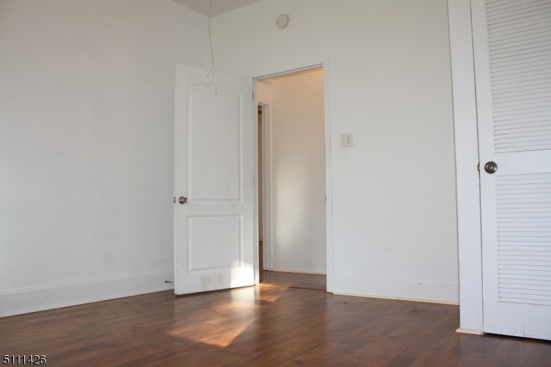 245 Millbrook Road Washington, NJ 07882 - Photo 26 of 34 a view of an empty room with wooden floor