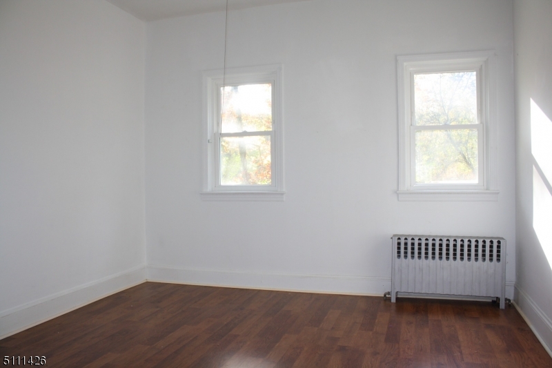 245 Millbrook Road Washington, NJ 07882 - Photo 27 of 34 an empty room with a window and wooden floor