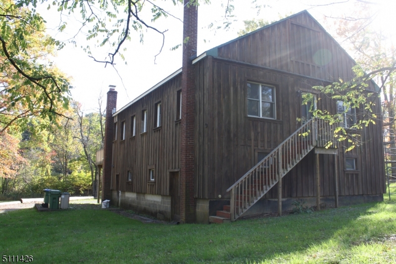 245 Millbrook Road Washington, NJ 07882 - Photo 3 of 34 a view of backyard with barbeque grill and a small yard
