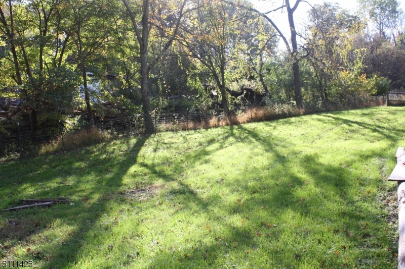 245 Millbrook Road Washington, NJ 07882 - Photo 31 of 34 a backyard of a house with lots of green space