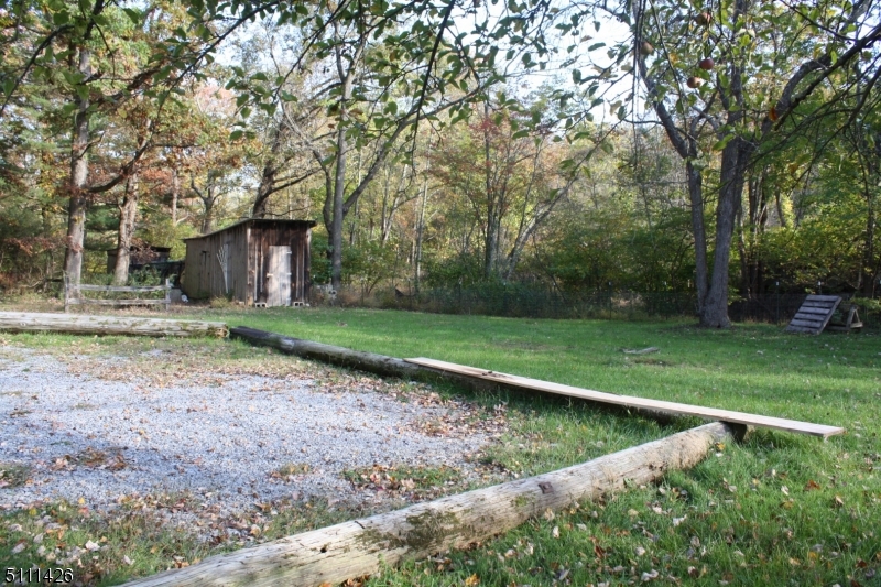 245 Millbrook Road Washington, NJ 07882 - Photo 32 of 34 a view of a backyard with large trees