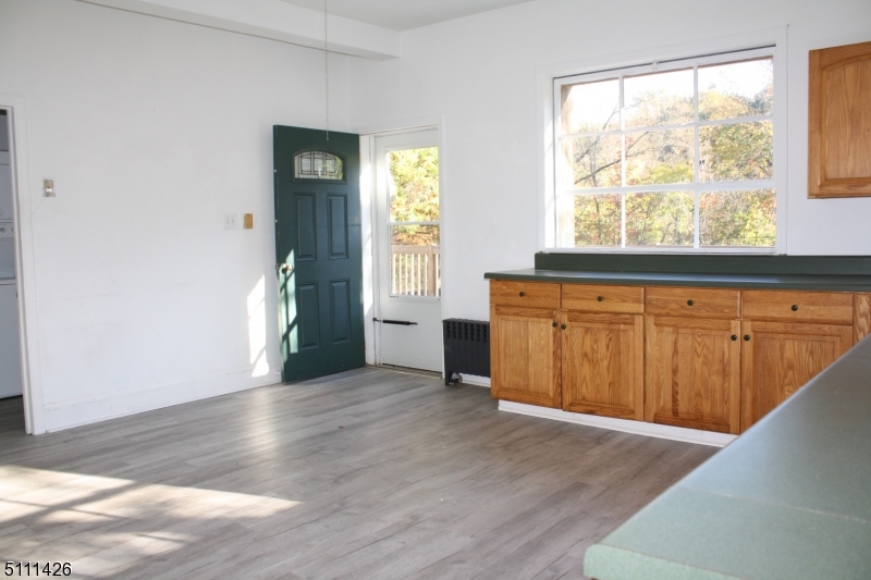 245 Millbrook Road Washington, NJ 07882 - Photo 5 of 34 a view of a kitchen with wooden floor and a window