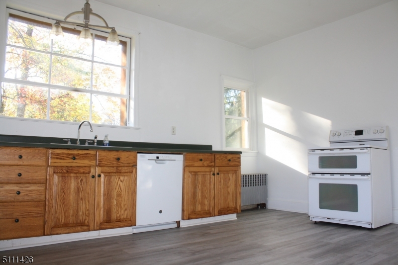245 Millbrook Road Washington, NJ 07882 - Photo 7 of 34 a kitchen with stainless steel appliances granite countertop a stove a sink and a microwave