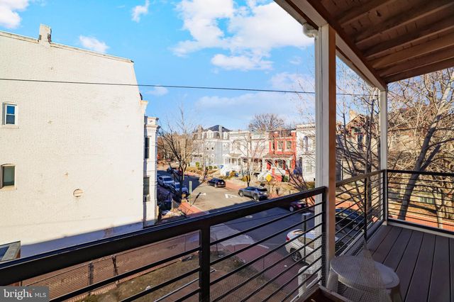 a view of a balcony with wooden floor