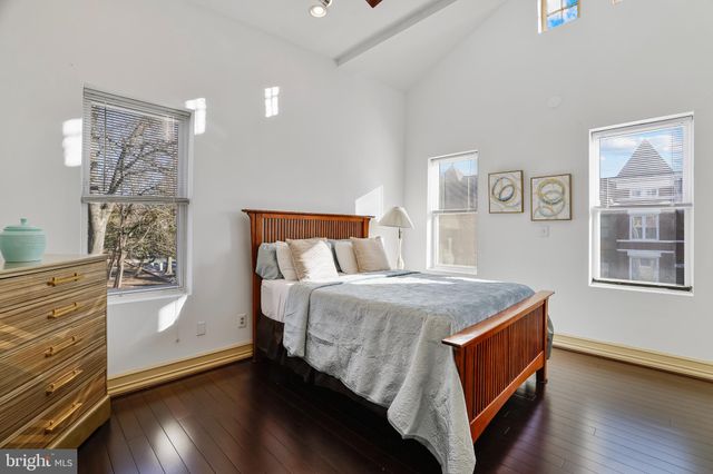 a bed room with a bed and a window