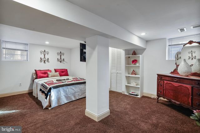 a room with furniture and white walls