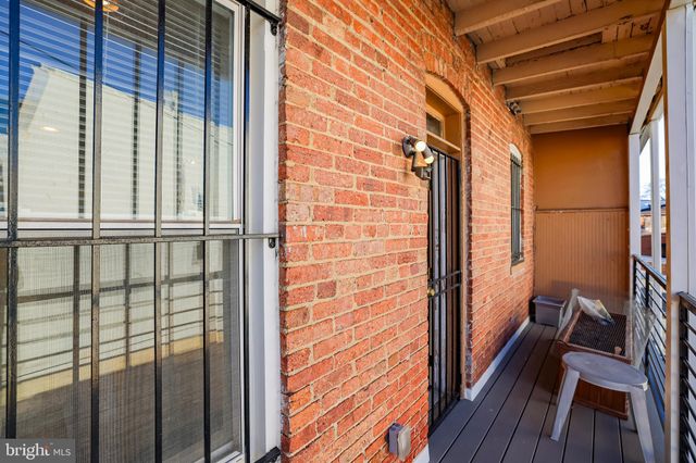 a view of a balcony with wooden floor