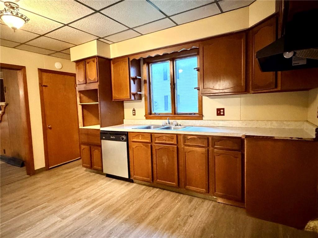 1408 State Rte 1042 Nu Mine, PA 16244 - Photo 11 of 19 a kitchen with stainless steel appliances granite countertop a sink and wooden cabinets