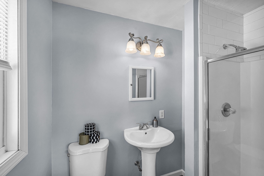 315 East Street South Suffield, CT 06078 - Photo 15 of 31 a bathroom with a toilet sink and mirror
