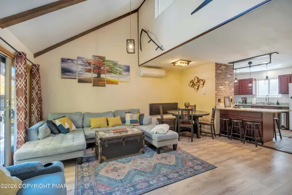 a bedroom with a bed and a couch