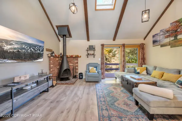 a bedroom with furniture and a flat tv screen