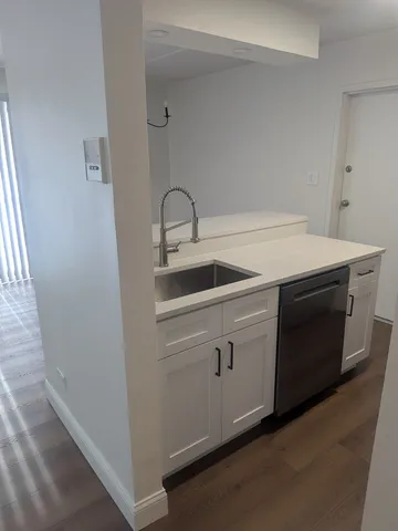 a close view of a stove and sink