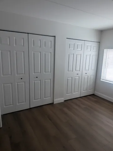 a view of a livingroom with wooden floor