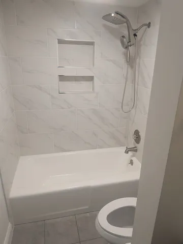 a bathroom with a sink a toilet and a bathtub