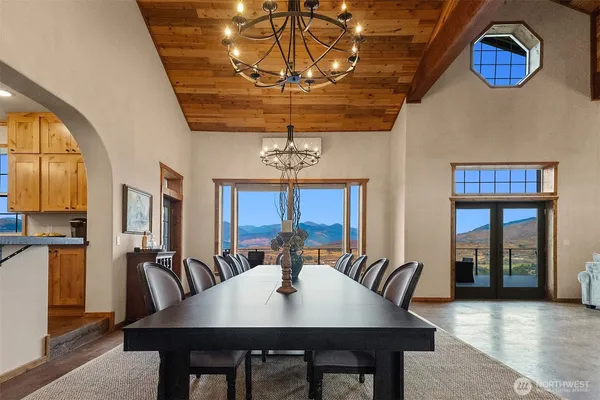 a view of a a dining room with furniture window and wooden floor