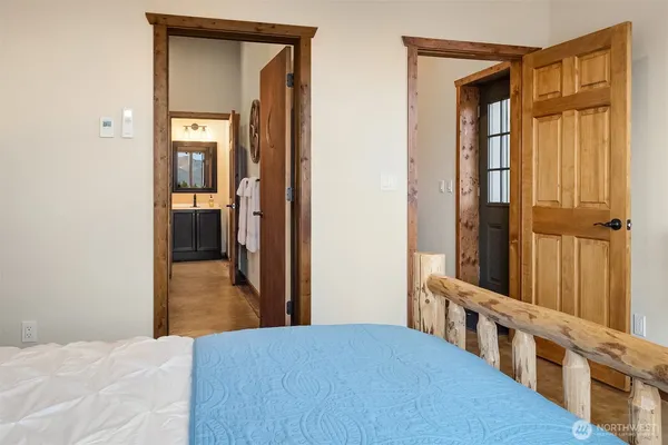 a view of a bedroom from a hallway