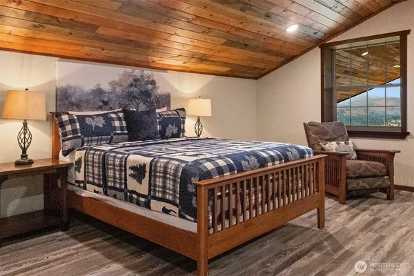 a bed sitting in a bedroom next to a balcony