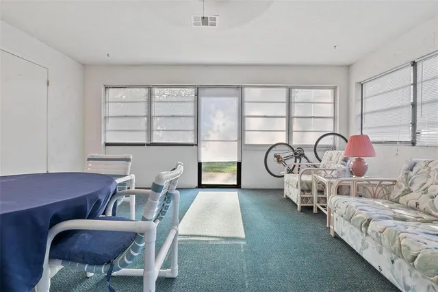 a view of a livingroom with furniture and window