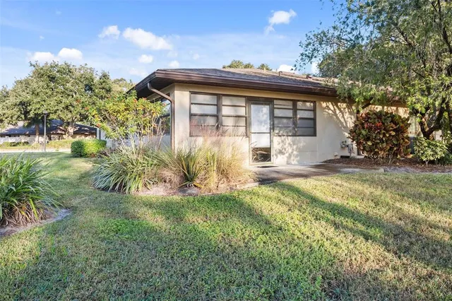 a view of a house with a yard